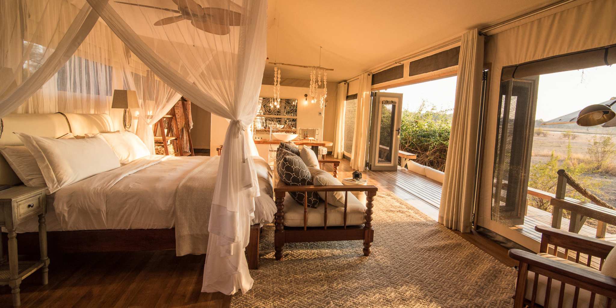 Sunset view from luxury canopy bed