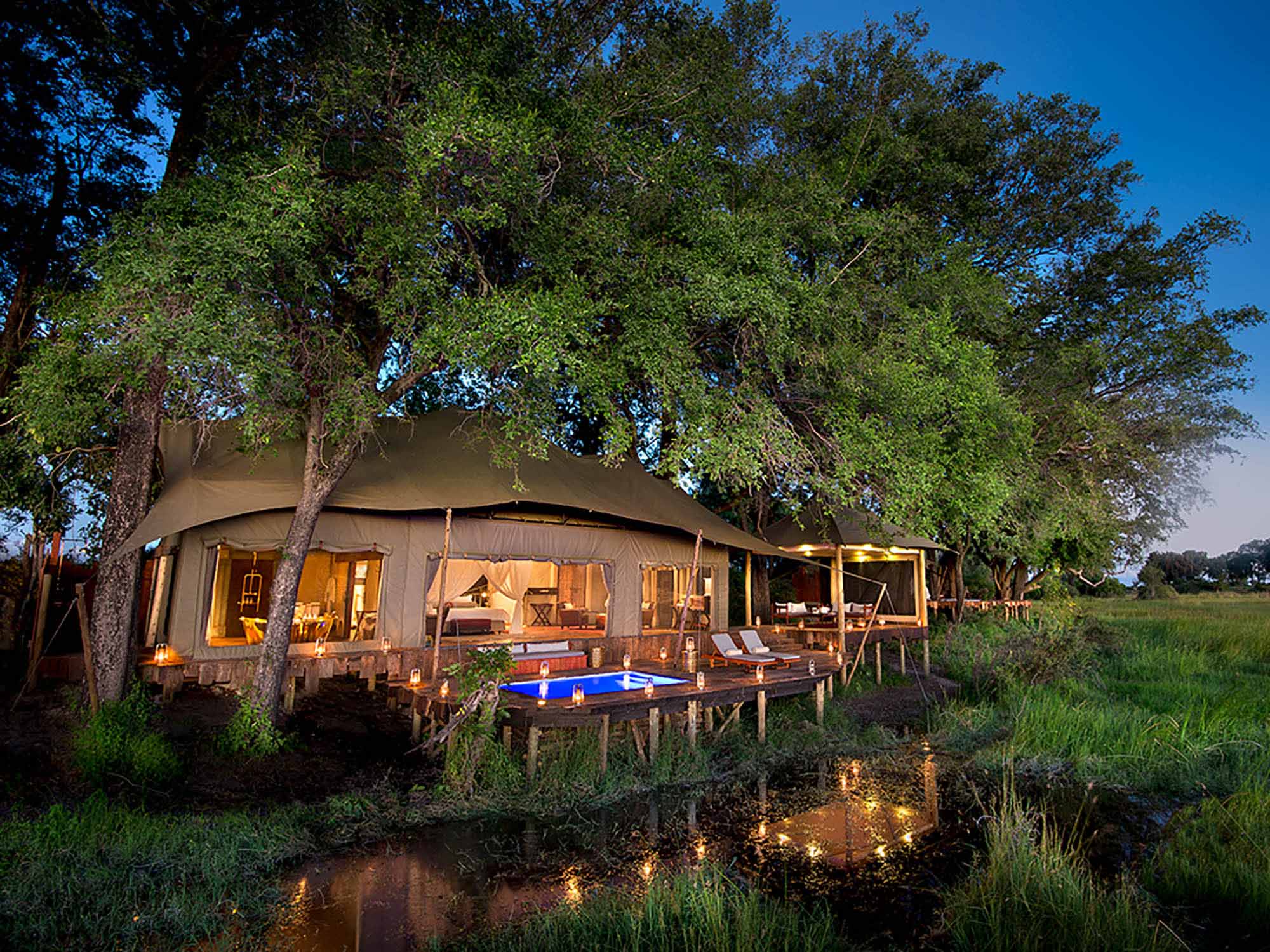 each tent features a private plunge pool and views of the surrounding floodplain. The main area consists of a large dining room and comfortable lounge with wine cellar and library. Duba Plains prides itself on its extraordinary wildlife experience from lions and leopards to elephants and buffalo and everything in between. Game drives take place in adapted vehicles uniquely designed to traverse the floodplains and guests also have the opportunity to view wildlife on foot or by mokoro.