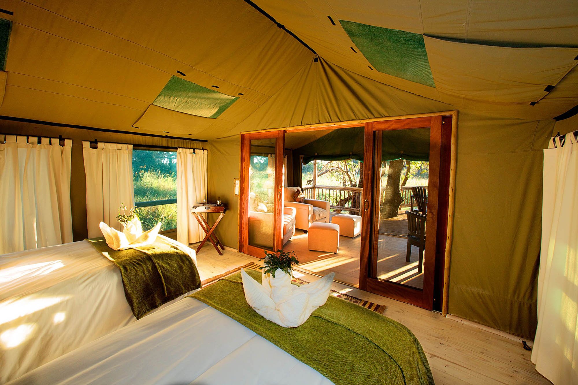 campfire boma and swimming pool. Mokoro excursions are propelled from the stern by skilled ‘poler’ guides