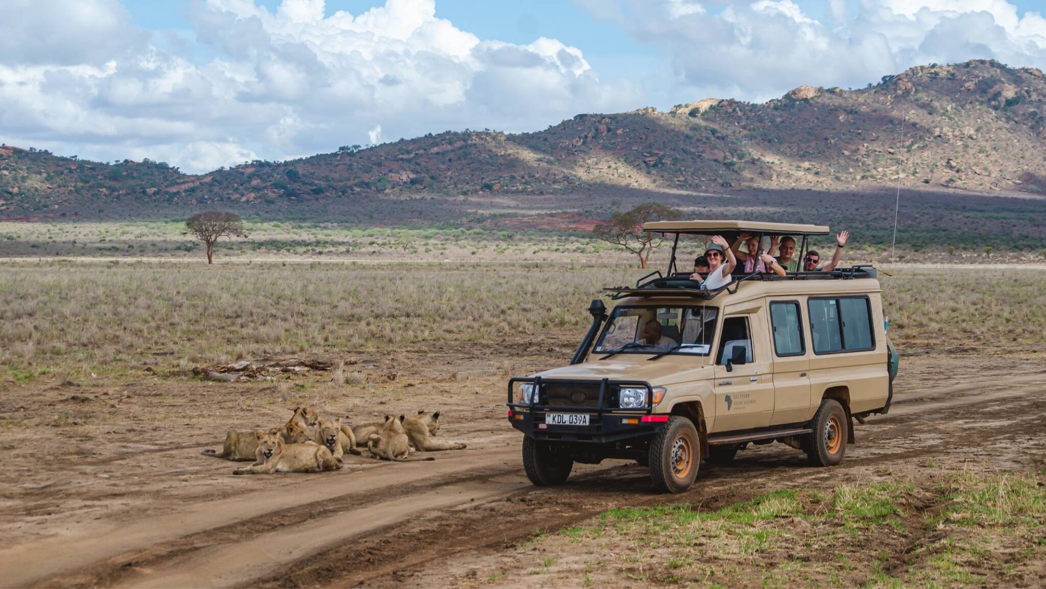 Southern Cross Safaris 4X4 next to a lion pride