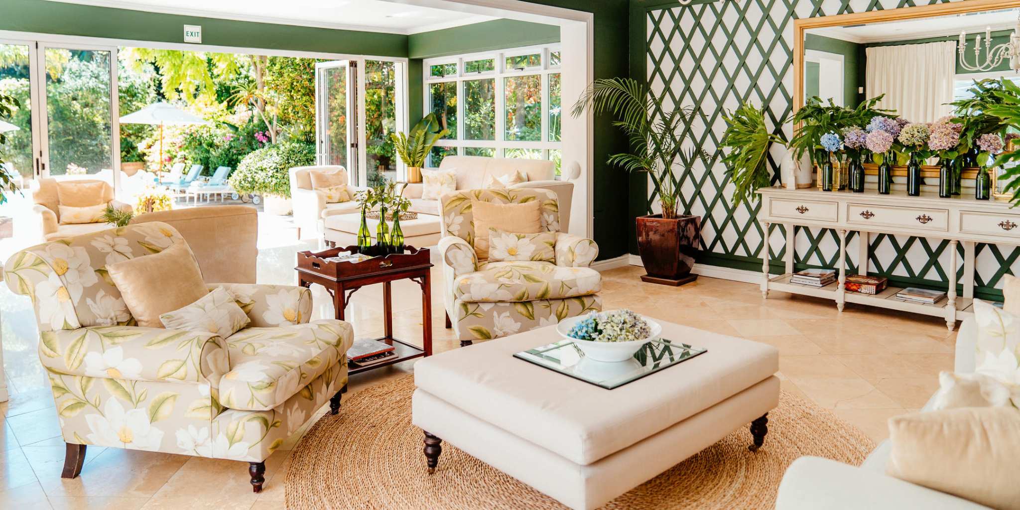 Light filled lounge area surrounded by greenery