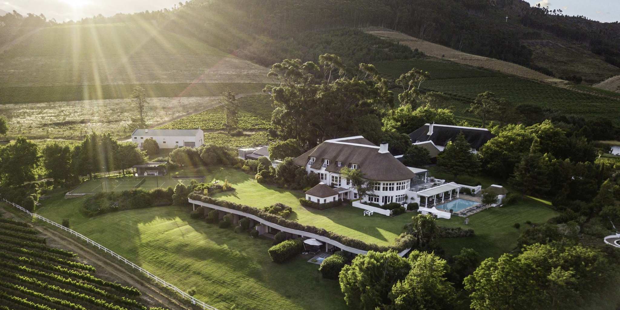 Hotel surrounded by a vinyard and mountains