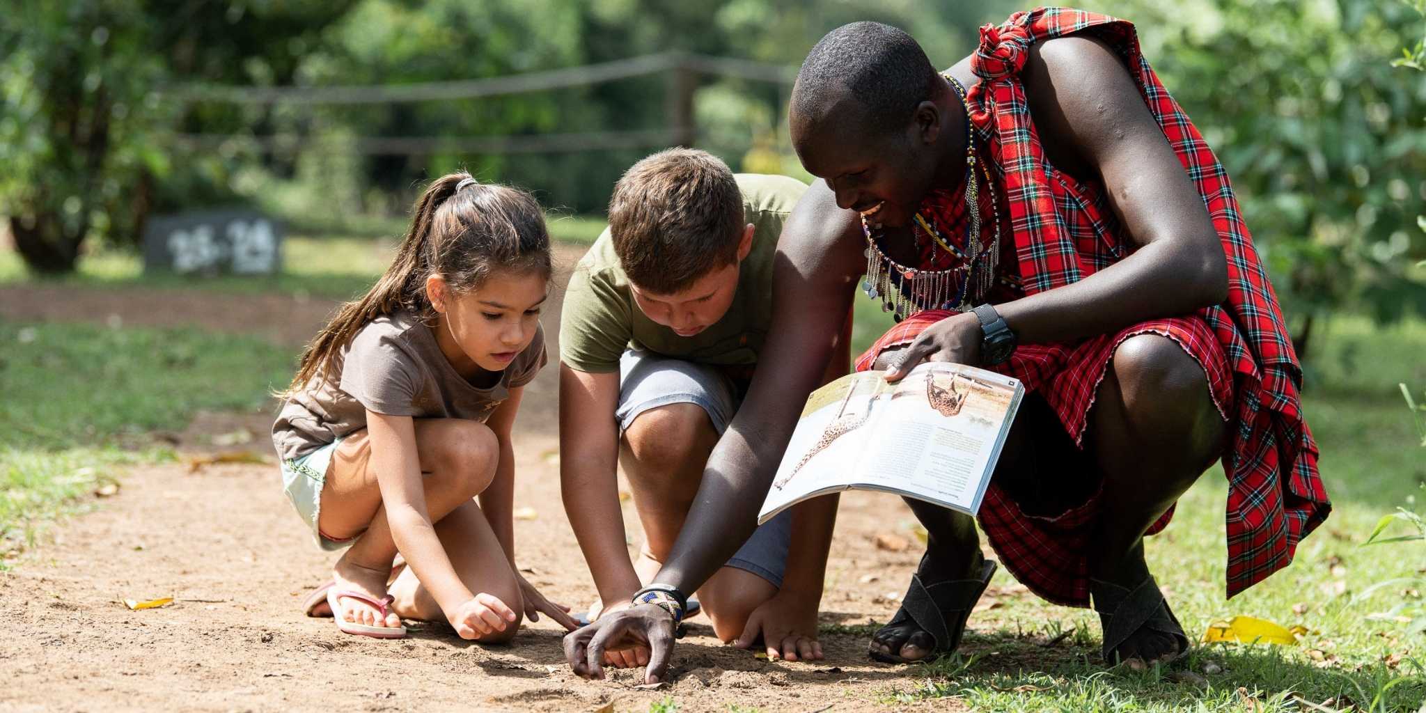 Two child and a guide immersed in nature