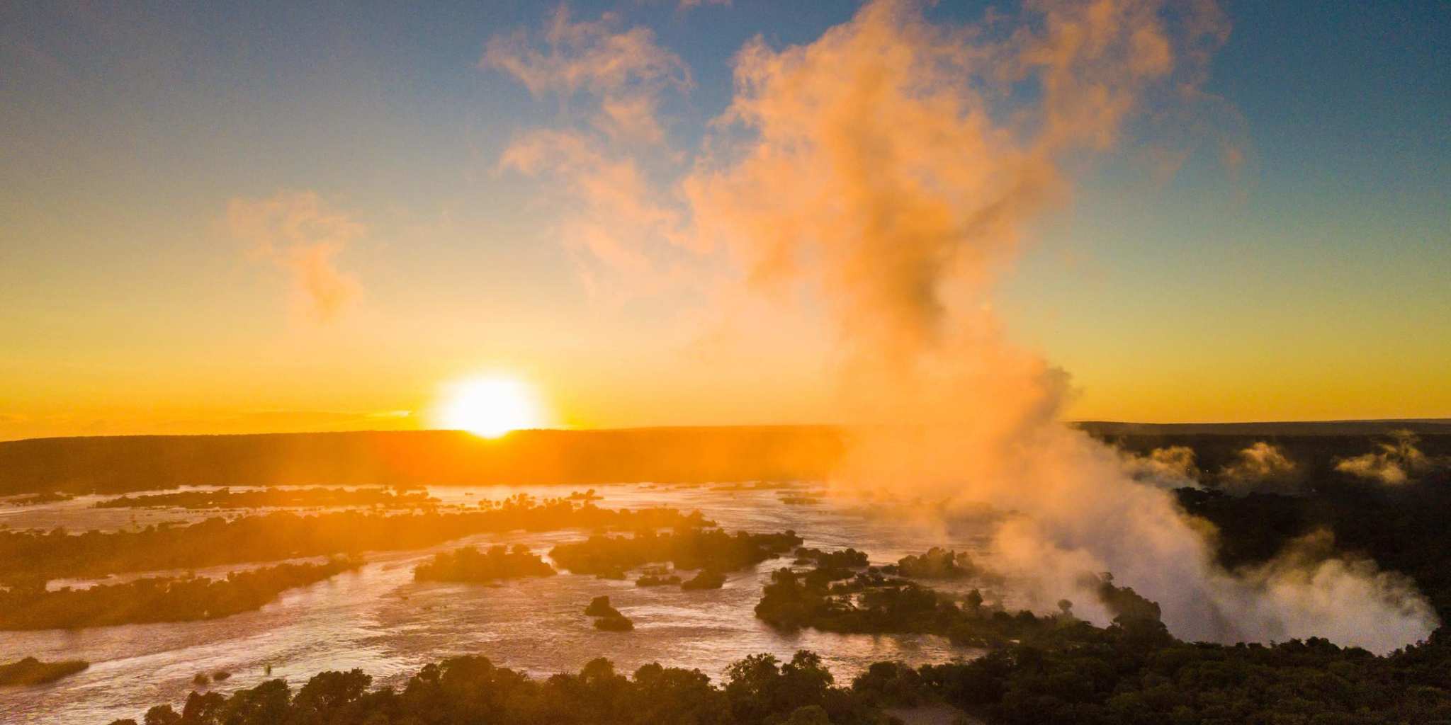 sunset with the Spray from Vic falls